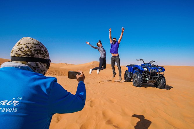 Dubai Red Dunes ATV, Camels, Stargazing & 5<em> BBQ Al Khayma Camp – Key things to know before booking’ /></p>
<ul>
<li><strong>The red dunes are the main event:</strong> The Lahbab desert brings tall, orange-red dunes and better photo stops than a flat sand area.</li>
<li><strong>Your ATV time lasts about 60 minutes:</strong> You ride after a safety briefing, with a guide nearby, then stop for sandboarding and photos.</li>
<li><strong>Al Khayma Camp is more than a dinner stop:</strong> You can try camel riding, henna, Arabic clothing, falcon photos, shisha, coffee, dates, and live shows.</li>
<li><strong>Evening departures offer the fullest program:</strong> Fire performances and stargazing are included with evening times, but not with the 11:30 AM option.</li>
<li><strong>The ATV carries real responsibility:</strong> You must be over 14, sign an indemnity form, and pay for damage caused during the ride.</li>
<li><strong>Guides make a real difference:</strong> Guides such as Dennis, Asif Foji, Abdul Wahab, Imran Khan, Omar, and Youness are praised for being attentive, patient, and helpful with photos.</li>
</ul>
<h2>Leaving Dubai for the Lahbab red dunes</h2>
<p><img width="669" height="446" decoding="async" src=