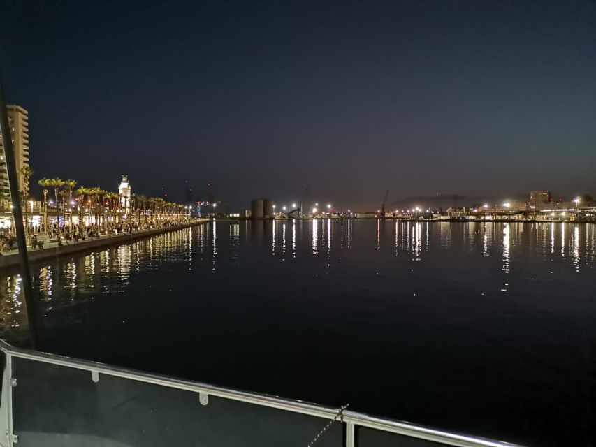 Malaga: A Sea of Stars Nighttime Stargazing Catamaran Tour - Leaving Malaga port after sunset