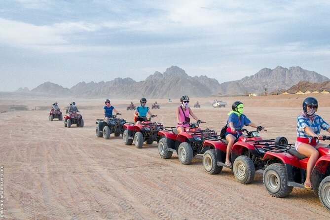 Stargazing And ATV Quad Bike And Camel Ride And Dinner With Show - Riding a quad bike across the Sinai Desert